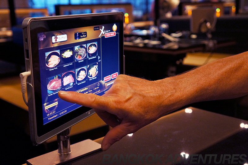 Touchscreen menu at Hajime Robot Restaurant in Bangkok